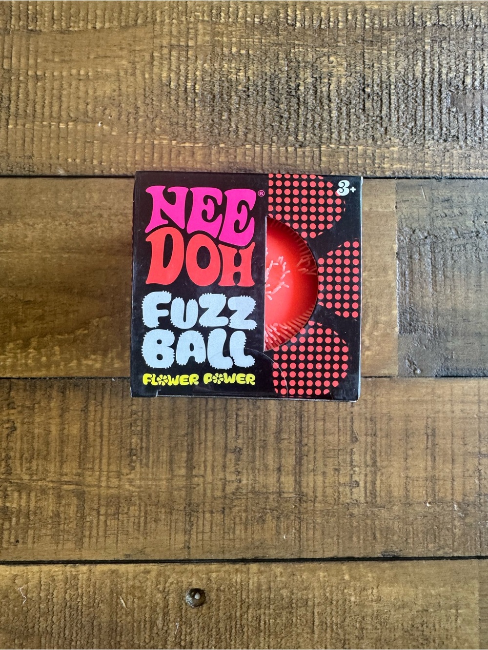 Brand new Needoh fuzzball orange flower power